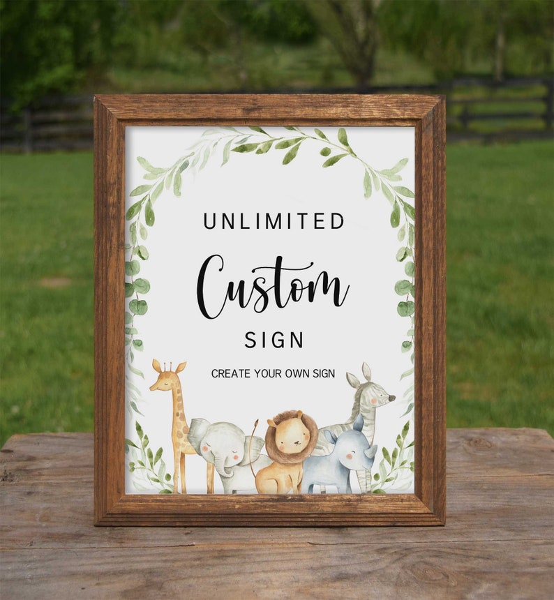 May include: A brown wooden frame with a white background and green foliage surrounding the text "UNLIMITED Custom SIGN CREATE YOUR OWN SIGN".  There are five cartoon animals in the bottom of the frame: a giraffe, an elephant, a lion, a rhino, and a zebra.
