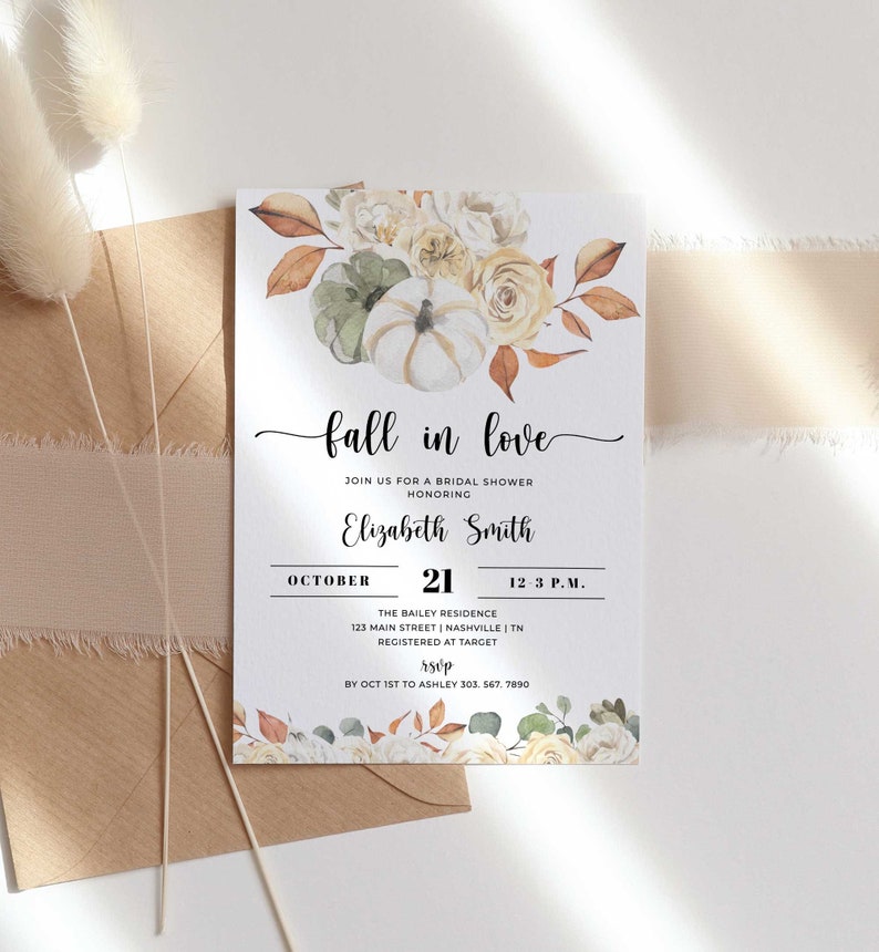 May include: A bridal shower invitation with a watercolour illustration of white pumpkins, autumn leaves, and flowers. The text reads "fall in love" and includes the bride's name, date, time, and location. RSVP information is also included.