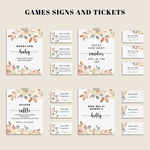 May include: A collection of baby shower game signs and tickets. The signs and tickets have a white background with floral and leaf accents in cream, orange, and green. The text includes "Books for Baby", "Diaper Raffle", and "How Big is Mommy's Belly".