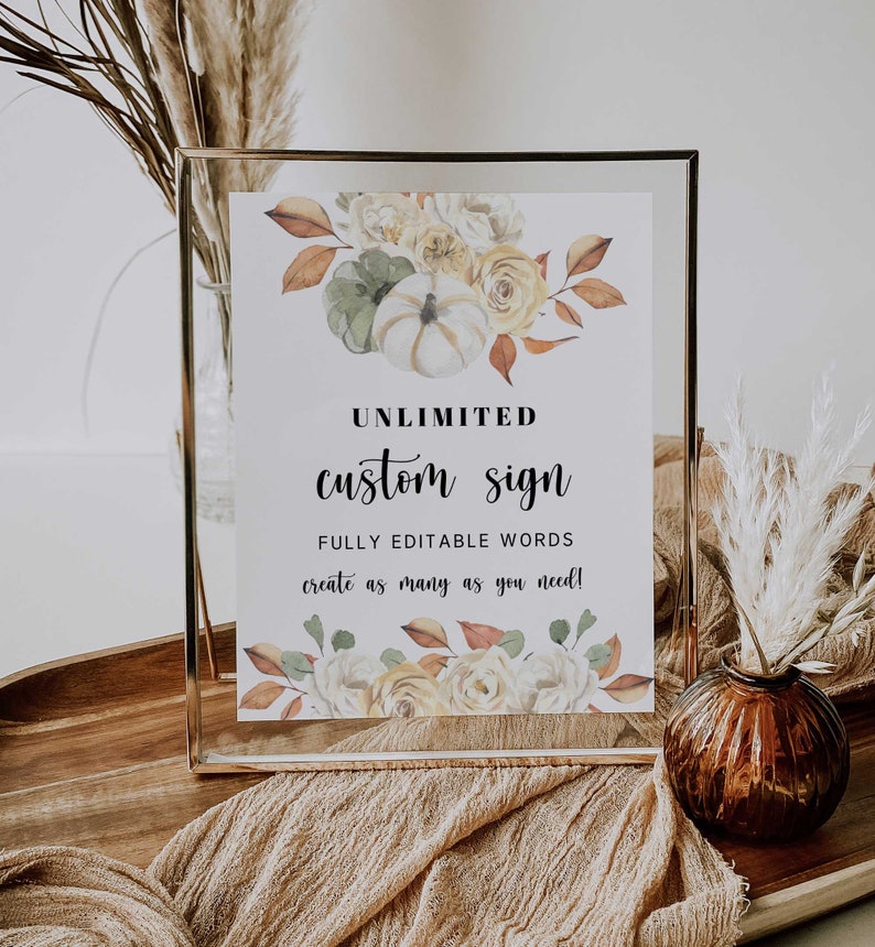 May include: A gold-framed sign with a watercolour floral design featuring pumpkins, leaves, and flowers. The sign reads "UNLIMITED custom sign FULLY EDITABLE WORDS create as many as you need!"