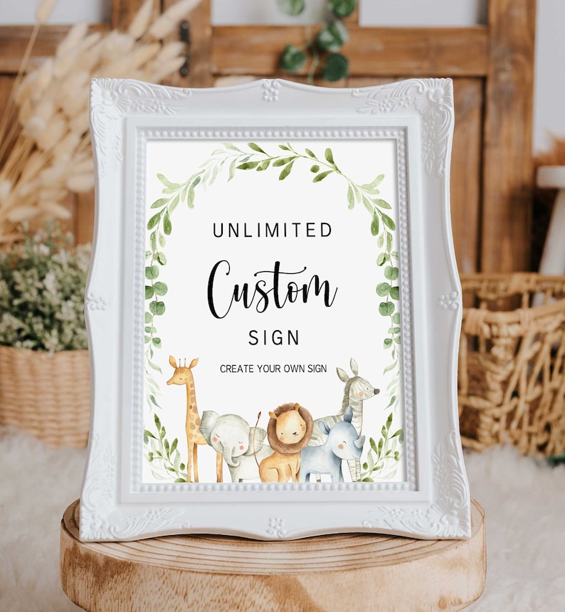 May include: White frame with a sign that says "Unlimited Custom Sign Create Your Own Sign". The sign has a green leafy border with a giraffe, elephant, lion, and zebra.