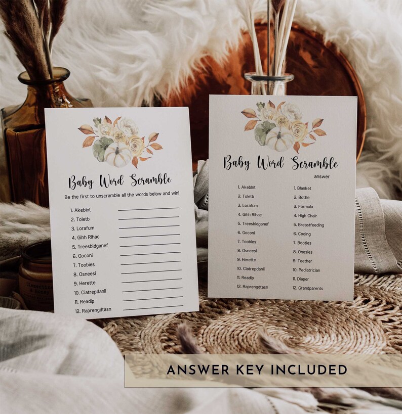May include: Two baby shower game cards with a floral design featuring pumpkins and leaves. The cards are labeled "Baby Word Scramble" and include a list of scrambled words and an answer key. The phrase "Answer Key Included" is at the bottom.