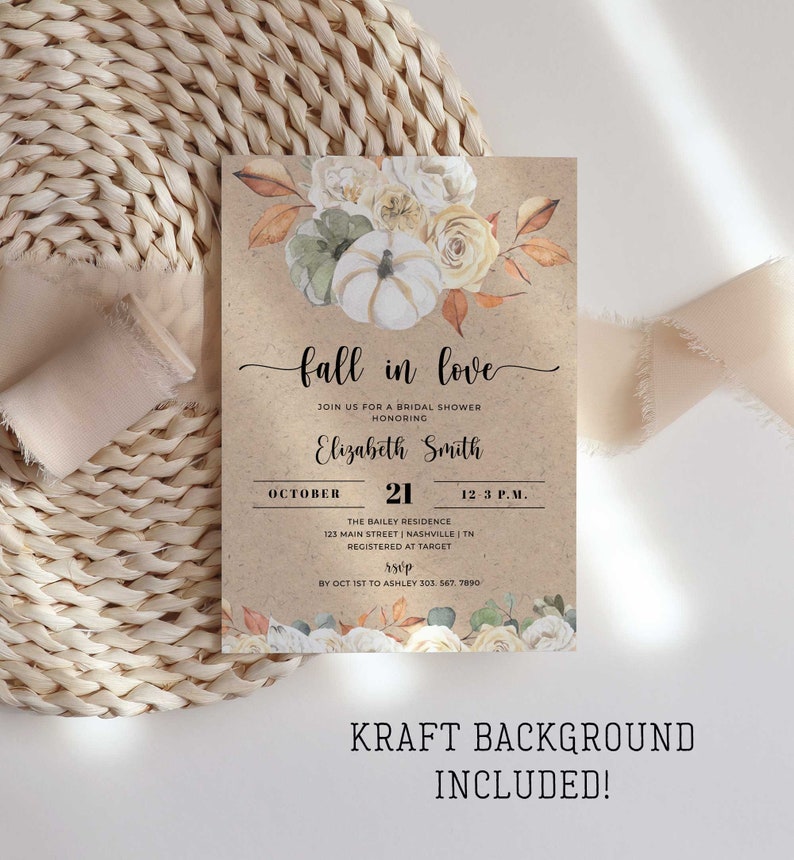 May include: Fall in love bridal shower invitation with a kraft paper background. The invitation features a watercolour illustration of white pumpkins, autumn leaves, and white and cream roses. The text on the invitation reads "Fall in love" and includes the date, time, and location of the shower.