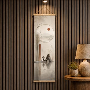 May include: A vertical wall hanging scroll featuring a serene landscape illustration with bamboo stalks, a circular sun, distant mountains, a small stone lantern, and a large rock reflected in calm water, framed by light wooden rods at the top and bottom.