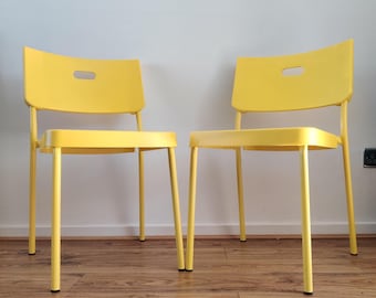 Pair of Vintage IKEA Herman chairs 2000s y2k bright yellow plastic.