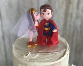Wonder Woman Kissing Superman Wedding Cake Topper