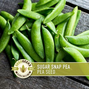 May include: A pile of fresh, green sugar snap peas on a weathered wooden surface. The image includes a logo that reads "Seed Geeks" and the text "Sugar Snap Pea Seed".