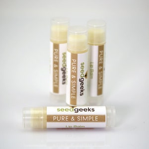 May include: Three clear tubes of lip balm with a white label that reads "seedgeeks PURE & SIMPLE Lip Balm".
