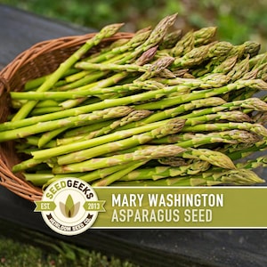 A basket filled with fresh, green asparagus stalks sits on a wooden surface, with a logo and text indicating the brand and product name.