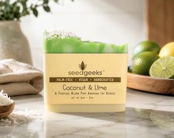 May include: A rectangular bar of soap with a green and white marbled top topped with coconut flakes. The label reads seedgeeks, Palm-Free, Vegan, Handcrafted, Coconut & Lime, A Tropical Blend That Awakens The Senses, Net Wt 4oz - 5oz.
