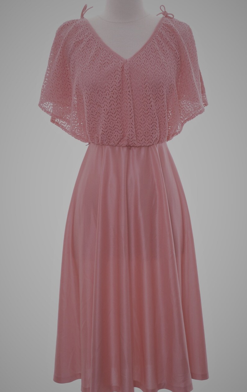Vintage 1970s disco dress flutter sleeves swingy skirt and ties at shoulder a soft knit sensation with a lacy bodice Vintage size 910
