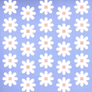 May include: A light blue fabric featuring a repeating pattern of white eight-petaled flowers. Each flower has a small, solid light pink square at its center. The design is arranged in a grid-like formation across the entire surface of the material.