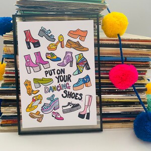 May include: A colorful illustration of various shoes with the text "Put on your dancing shoes" in a rainbow font.