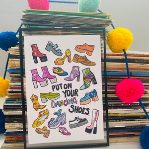 May include: A white print with a colorful illustration of various shoes and the text "Put on your dancing shoes".