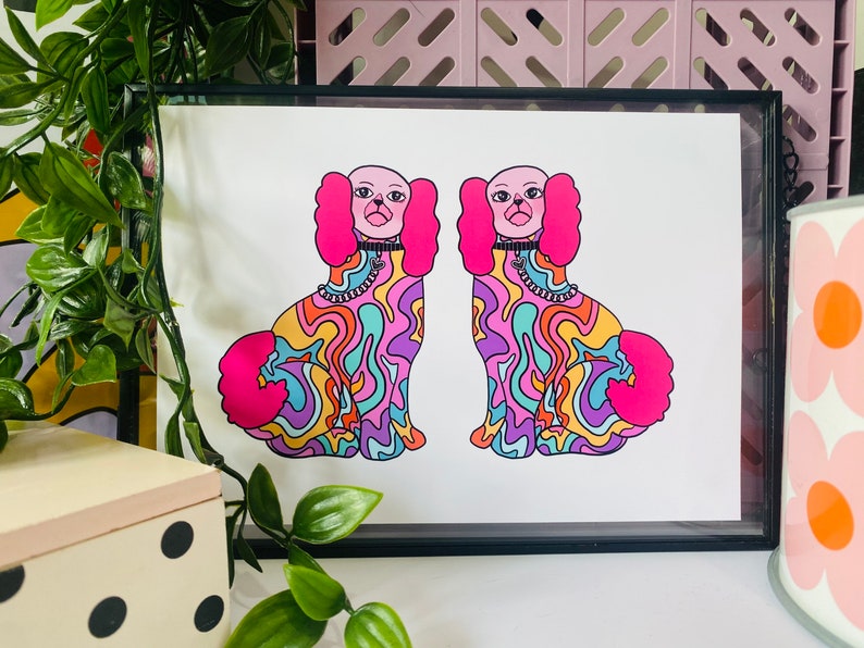 May include: A print of two psychedelic dogs with pink fur, colorful swirls, and black collars. The dogs are facing each other and are in a mirrored pose.