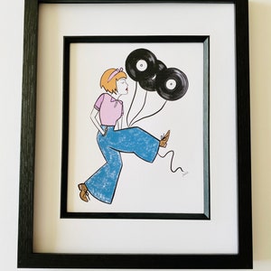 May include: A framed illustration of a woman with short blonde hair wearing a pink shirt and blue jeans. She is holding three black vinyl records as balloons. The illustration is signed "Julie".