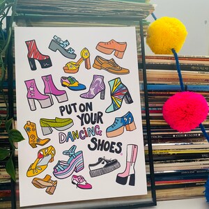 May include: A colorful illustration of various shoes with the text "Put on your dancing shoes." The shoes are drawn in a cartoon style and include boots, sandals, sneakers, and heels.