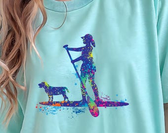 Stand Up Paddleboard Comfort Colors splatter design unisex T-shirt featuring a Girl and her Dog
