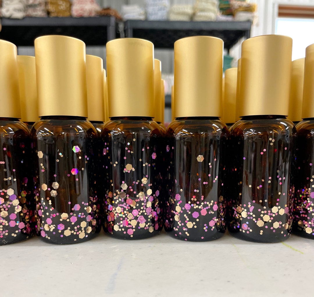 Rosie Posie 30ml AMBER glitter roller bottle- metal roller ball. Pink & gold roller bottle