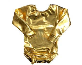 May include: A shiny gold bodysuit with long sleeves. The garment has a scoop neckline and is made of a metallic, reflective material. The bodysuit is designed to fit snugly and has a gathered bottom.