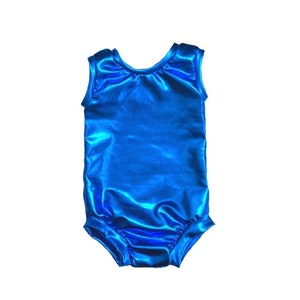 May include: A sleeveless leotard in a bright blue metallic fabric. The leotard has a scoop neck and a fitted silhouette.