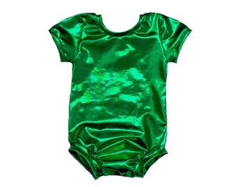 May include: A shiny, emerald green bodysuit with short sleeves. The fabric has a reflective, metallic sheen, creating a vibrant and eye-catching appearance. The garment is designed with a scoop neckline and a fitted silhouette.