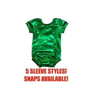 May include: A green metallic short-sleeved bodysuit with a round neckline. 5 Sleeve Styles! Snaps Available!