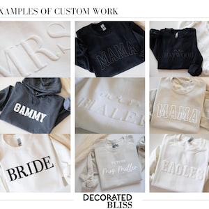 May include: Examples of custom work on sweatshirts and hoodies. The sweatshirts are white, black, and gray with various text designs including "Mrs", "Mama", "Gammy", "Bride", "Future Mrs. Miller", "Eagles", and "Haywood".