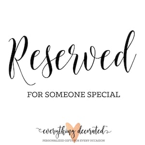 May include: A white sign with black calligraphy that reads "Reserved for Someone Special". The sign also includes a small pink heart with the text "everything decorated" in black calligraphy.