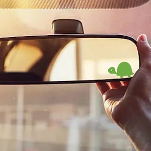 May include: A set of three ceramic mugs with a speckled, matte finish. The mugs are in shades of cream, light gray, and dark gray. Each mug has a simple, minimalist design, perfect for coffee or tea.