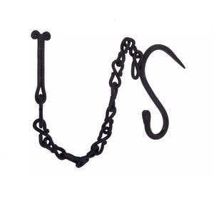 May include: Black wrought iron hanging hook and chain. The hook has a curved design with a pointed end. The chain is made of interlocking links. The top of the chain has a decorative element. Designed for hanging items.