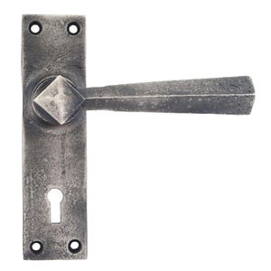 May include: A silver door handle with a square knob and a keyhole. The handle is made of metal and has a distressed finish.