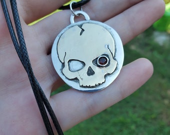 Skull with garnet eye necklace. Copper & sterling silver. 18inch necklace.