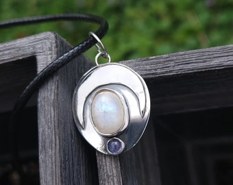 Rainbow moonstone and tanzanite necklace. 925 sterling silver. 18in black cord.