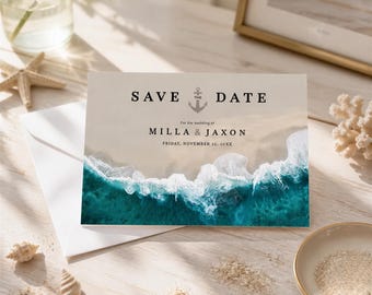 May include: A rectangular save the date card featuring a high-angle photograph of turquoise ocean waves crashing onto a sandy beach. The text reads SAVE THE DATE with an anchor icon, followed by For the wedding of MILLA & JAXON, FRIDAY, NOVEMBER 22, 20XX.