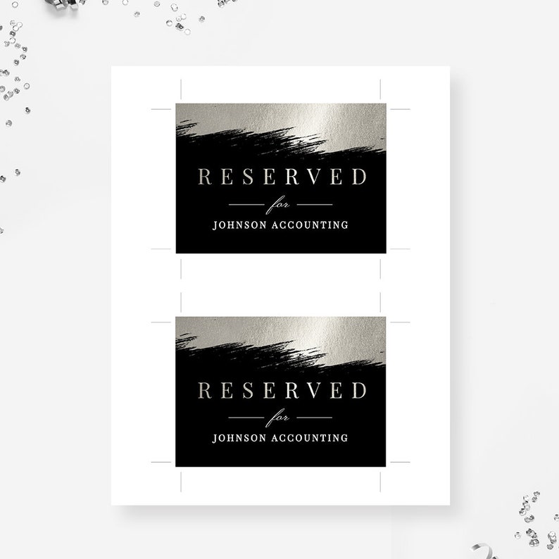 May include: Two black and silver table cards with the text "RESERVED for JOHNSON ACCOUNTING" printed in white.