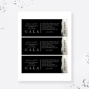 May include: Three black and silver admission tickets for a Pacific Coast University Law School Gala. The tickets have a black background with white text and a silver stripe with the words "ADMIT ONE" in white text. The text on the tickets includes the date, time, location, and dress code for the event.