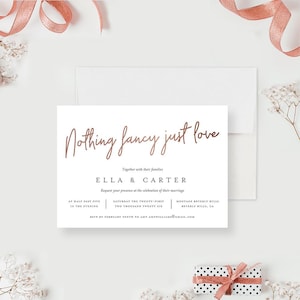 May include: A wedding invitation with a rose gold script font that says "Nothing fancy just love." The invitation is for Ella and Carter, and it includes the date and time of the wedding, as well as the location. The invitation is on a white background.