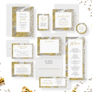 May include: Gold and silver marble patterned invitation suite for a charity ball. The invitation includes a save the date card, RSVP card, menu, and ticket. The text on the invitation reads "Hegmann Group's Charity Ball, Sunday, May 8th, 2024".