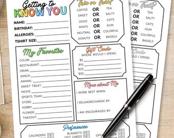 May include: Three sheets of paper with fill-in-the-blank prompts, including "Getting to Know You" and "Take or That?" Colorful text accents the pages. A black pen and a cup of coffee sit nearby, suggesting a casual setting for self-reflection or a fun activity.