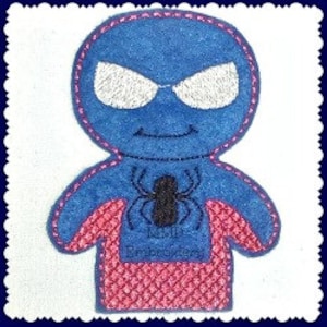 May include: Blue felt finger puppet with a red spider web design and a black spider. The puppet has a white face with black eyes and a black smile.