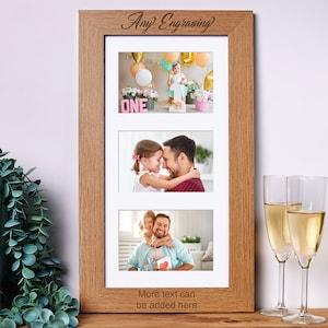 May include: A wooden picture frame with three openings for photos. The top opening shows a child holding a number one, the middle opening shows a father and daughter hugging, and the bottom opening shows a father and daughter smiling. The frame has the words "Any Engraving" and "More text can be added here" engraved on it.