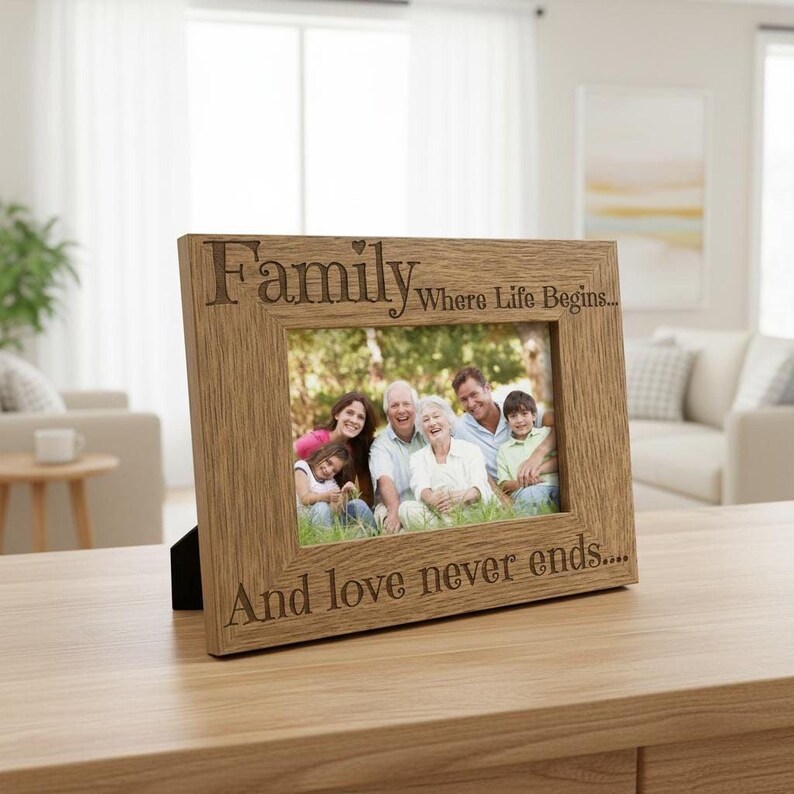 A wooden picture frame with a family photo inside, placed on a wooden table in a living room.