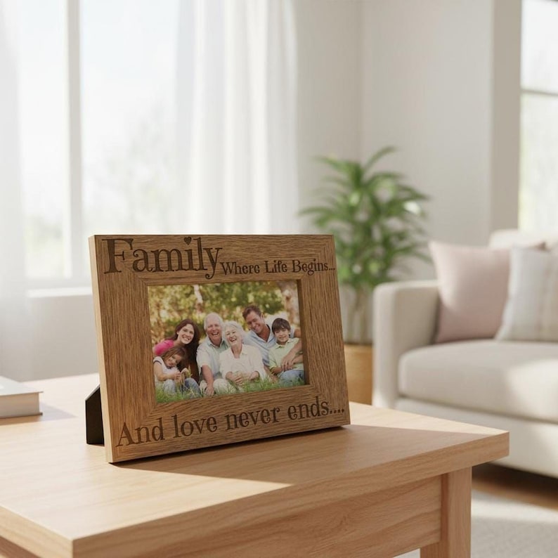 A wooden picture frame with a family photo inside, placed on a wooden table in a living room.