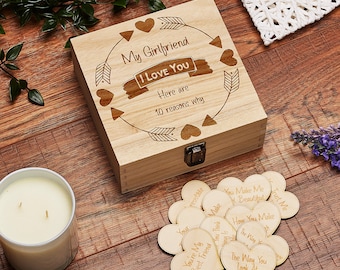 May include: A wooden box with a lid that opens to reveal 10 wooden hearts with reasons why someone loves their girlfriend. The box is engraved with the words "My Girlfriend I Love You Here are 10 reasons why".