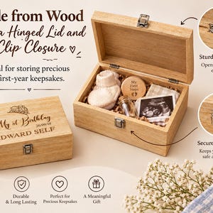 a wooden box with a hinged lid and clip closure, designed for storing first-year keepsakes. The box is made of natural wood and has a sturdy hinge for easy closure. It contains a photo of a baby's feet, a memento, and a card. The box is described as ideal for storing precious first-year keepsakes and is made from natural wood, ensuring durability and long-lasting quality. The box also has a secure clip closure to keep the contents safe and protected.