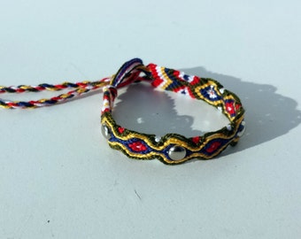 Knotted friendship bracelet with silver studs