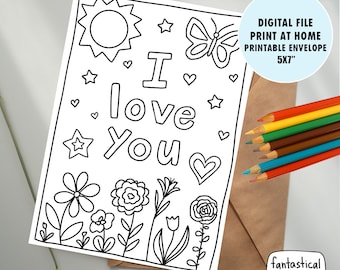 May include: Printable coloring page of an envelope with the words "I love you" surrounded by flowers, stars, and hearts. The envelope is 5x7 inches.