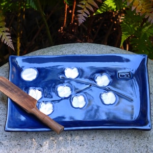 Blue butter dish with white blossoms