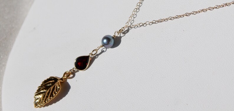 14K gold chain necklace with vermeil vintage gold leaf design and bright red garnet gem